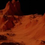 a group of mountains covered in sand at night