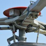 a close up of a helicopter with a sky background