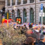 a large group of people standing in front of a building
