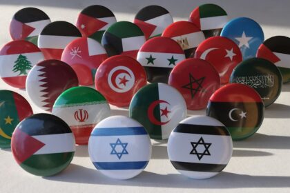 a bunch of different colored balls with flags on them