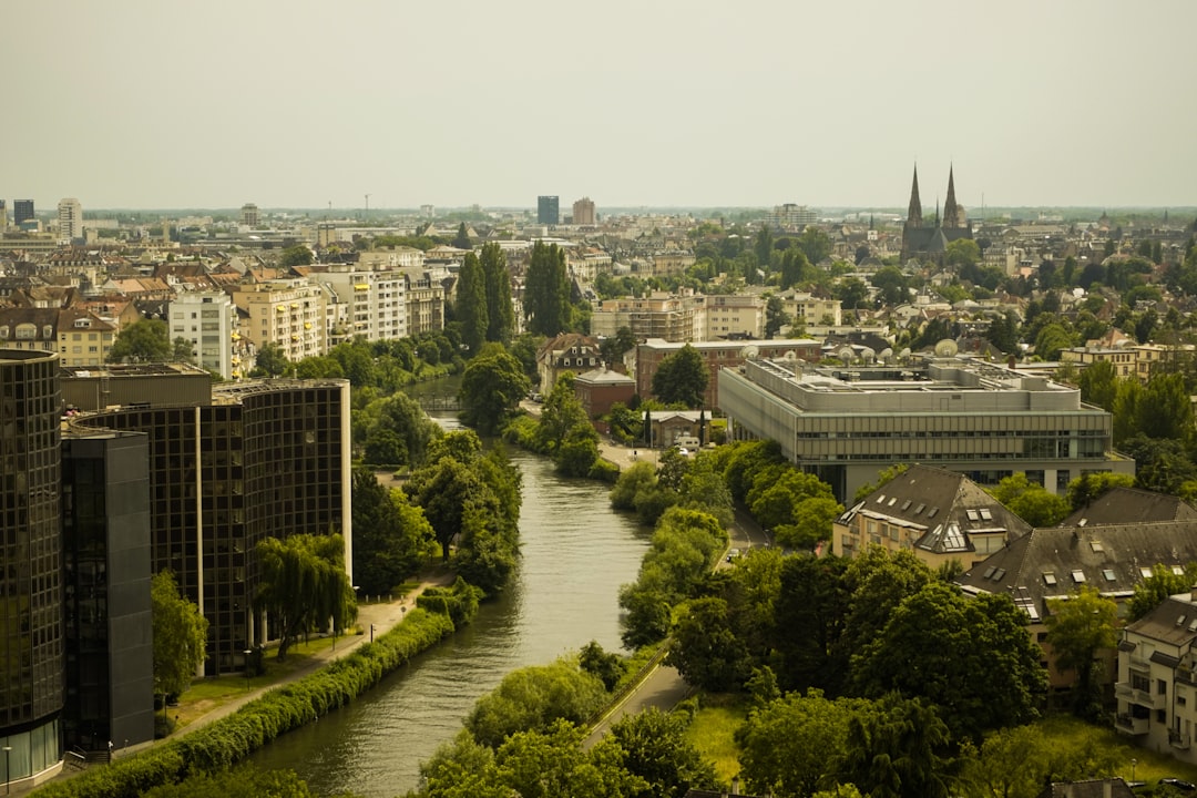 A river running through a city next to tall buildings