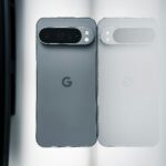 Two cell phones sitting next to each other