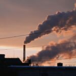 A factory with smoke coming out of it's stacks
