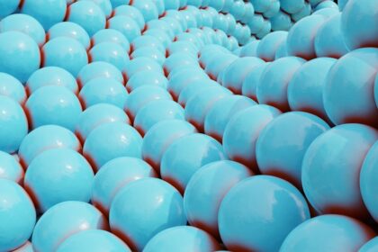 Rows of light blue spheres form a spiral pattern.