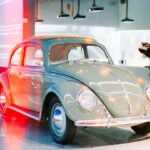 A vintage light green volkswagen beetle car