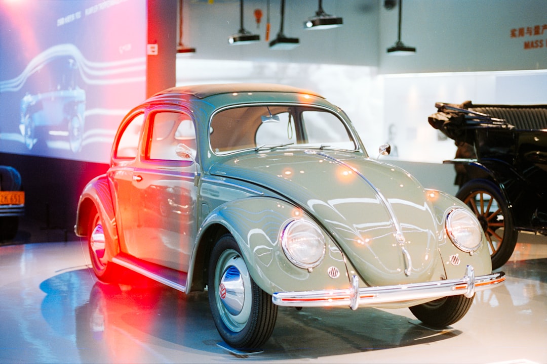 A vintage light green volkswagen beetle car
