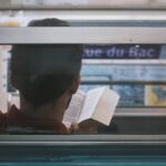 man reading inside train