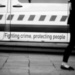 grayscale photography of police vehicle