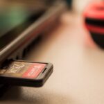 black micro SD card adapter plugged in laptop computer