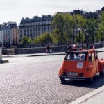 orange vehicle running on park