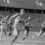 four man running on the field