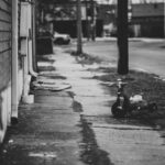 grayscale photo of a ride on toy car on the street