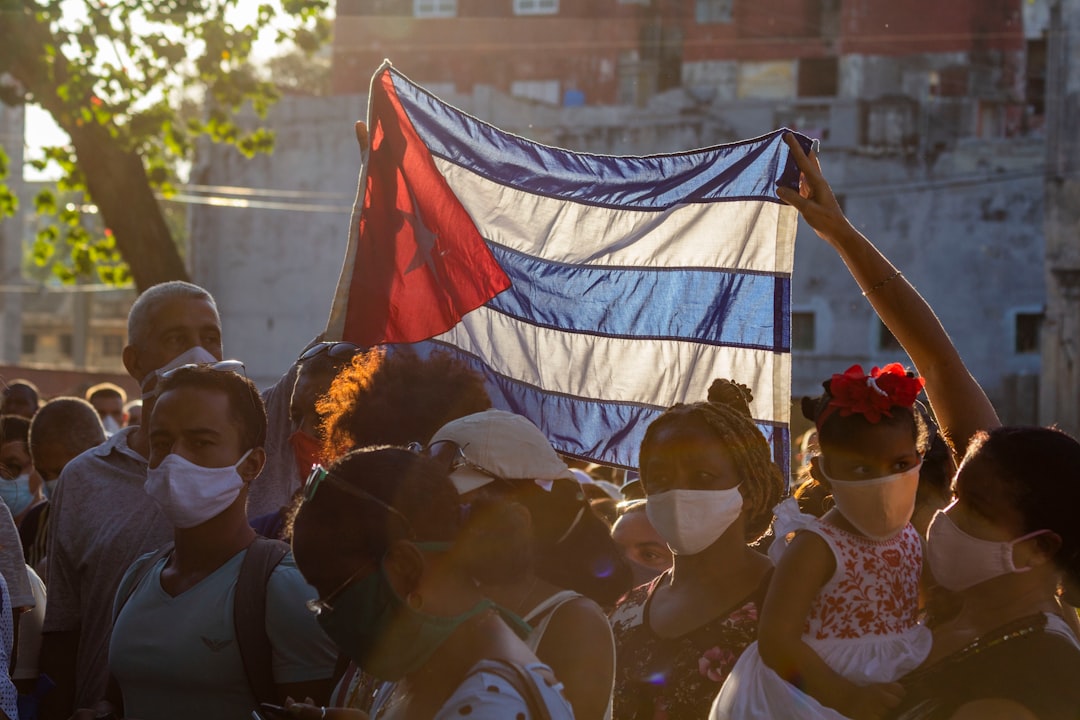 people holding flags during daytime