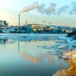 blue and white boat on water under white clouds and blue sky during daytime