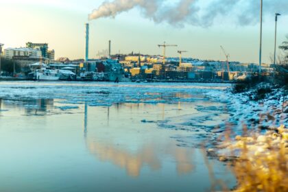 blue and white boat on water under white clouds and blue sky during daytime