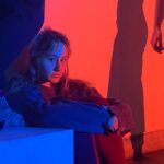 woman in blue jacket and blue denim jeans