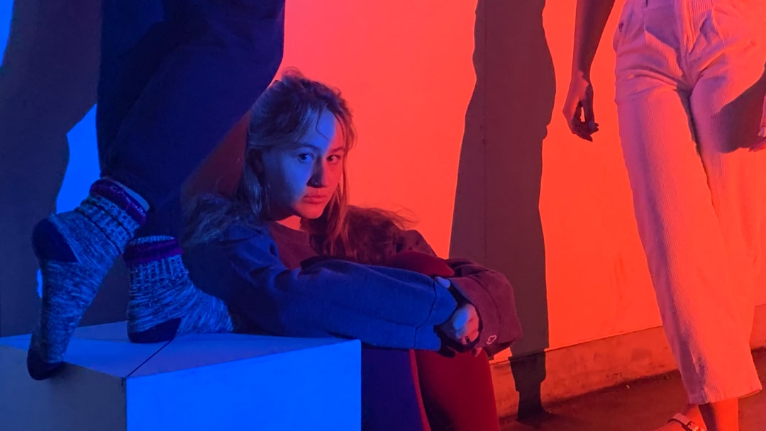 woman in blue jacket and blue denim jeans