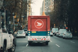red and white bus on road during daytime