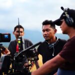 a group of men with cameras