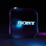 a purple rectangular object with a white logo on it