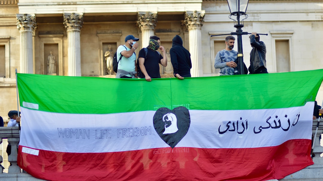 a group of people standing behind a banner
