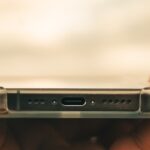 a close up of a person holding a cell phone