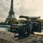 a camera set up in front of the eiffel tower