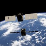 a satellite satellite flying over the earth