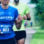 a group of men running down a road