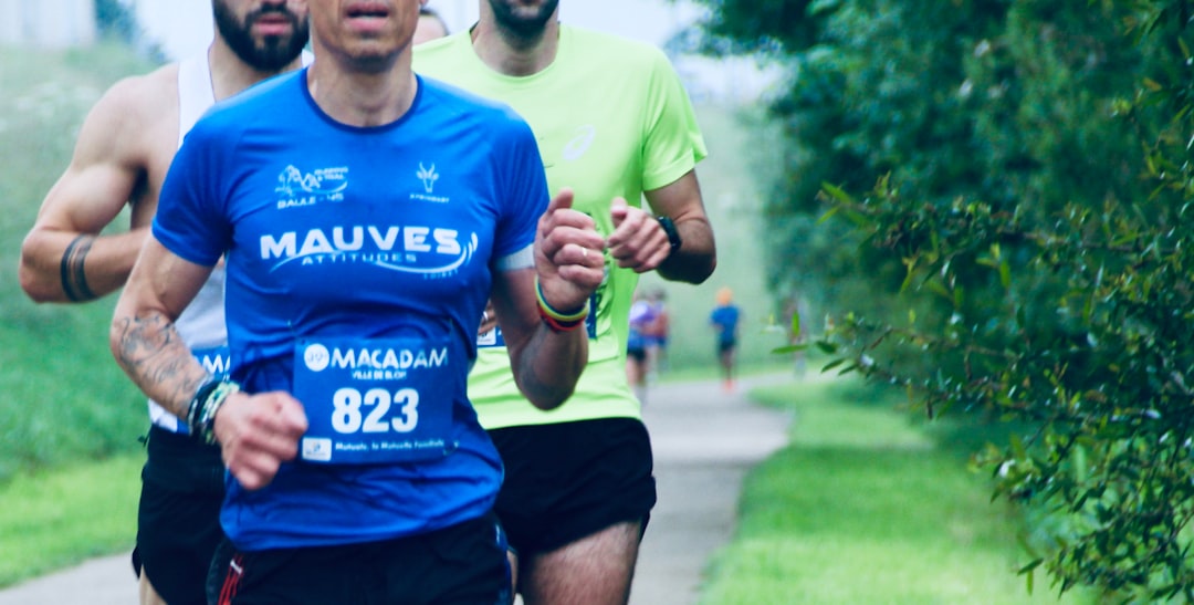 a group of men running down a road