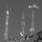 A black and white photo of cell towers