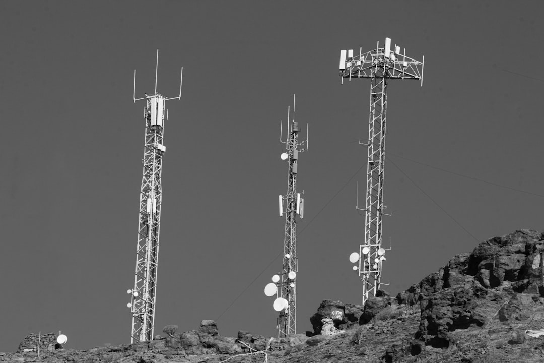 A black and white photo of cell towers