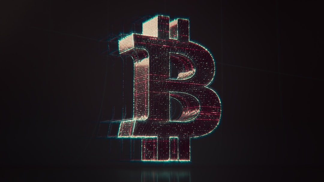 A shiny bitcoin logo on a black background