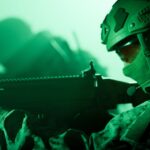 Soldier aiming rifle in green night vision