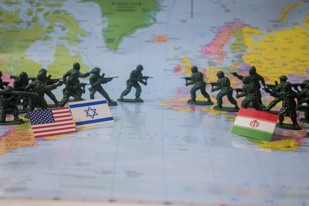 Toy soldiers face off with flags on world map