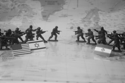 Toy soldiers facing each other with flags on map