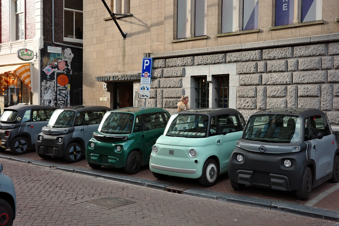 Several small cars parked in a row