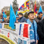 man wearing blue scarf