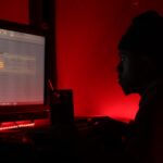 man in front of monitor