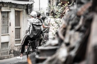 two people riding a bicycle