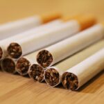 a group of cigarettes sitting on top of a wooden table
