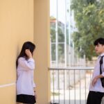 a couple of kids standing next to each other