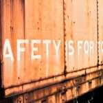 a rusted train car with the words safety is for all