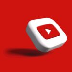 a white cube with a red arrow on a red background