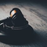 a judge's gaven on a wooden table