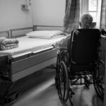 a person in a wheelchair in a room