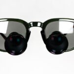 a pair of sunglasses with a black lens
