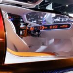 The interior of a futuristic car is shown