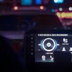 A dashboard of a car at night time