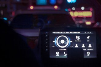 A dashboard of a car at night time